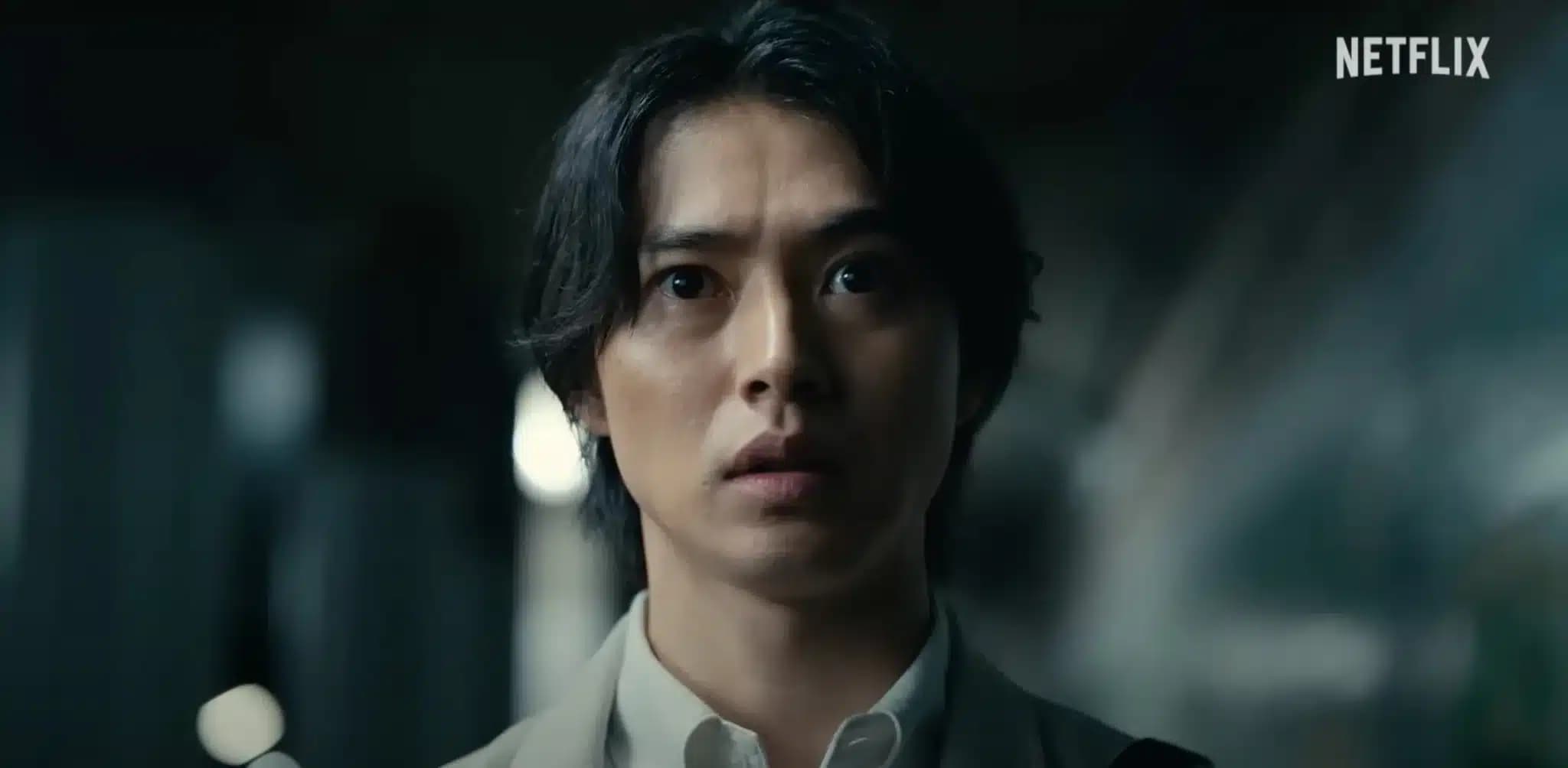Person with long hair looking surprised in a dark setting, with the Netflix logo in the top right corner.