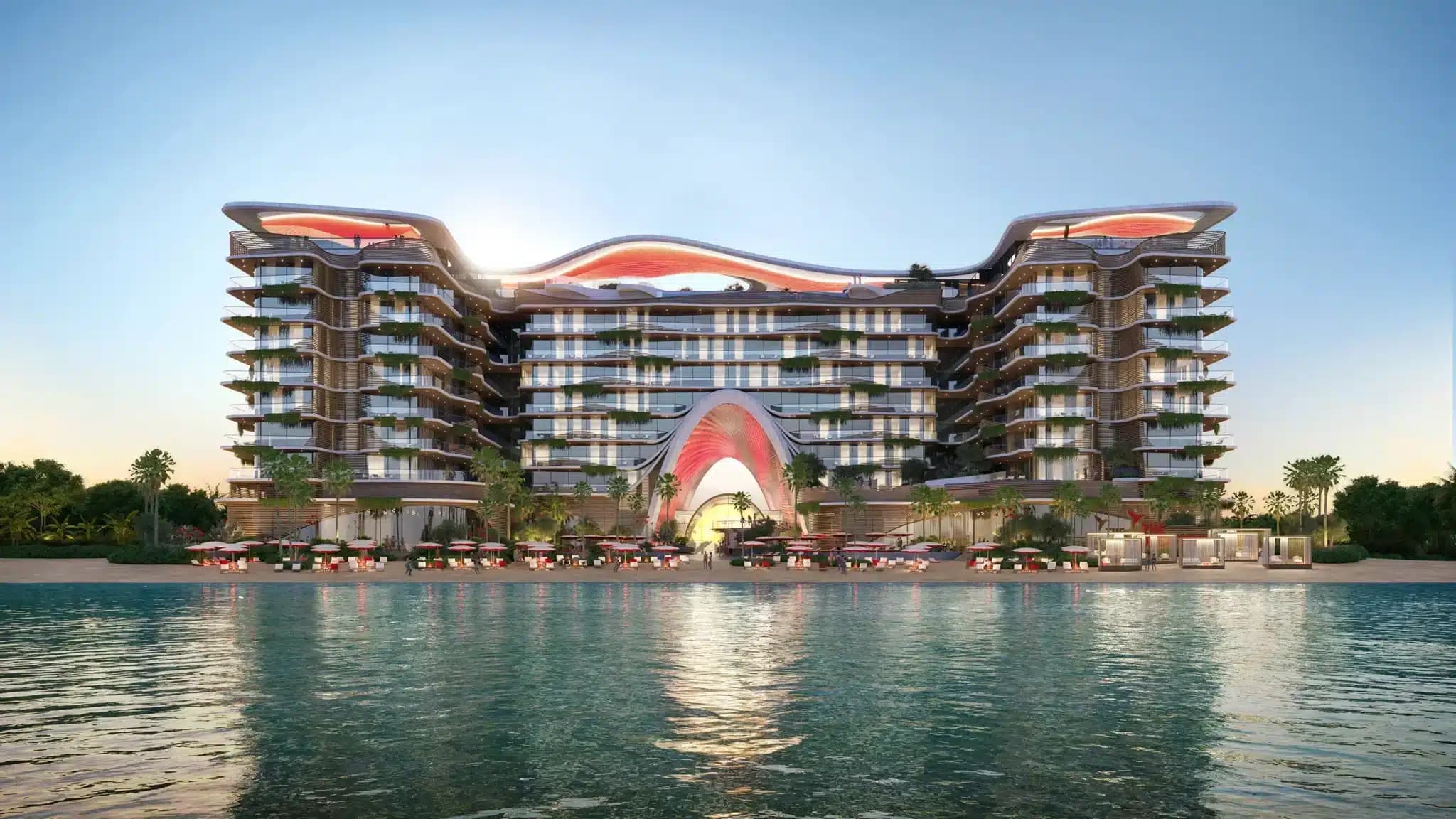 A modern beachfront resort with a unique wavy architectural design, featuring balconies and a sunset backdrop.