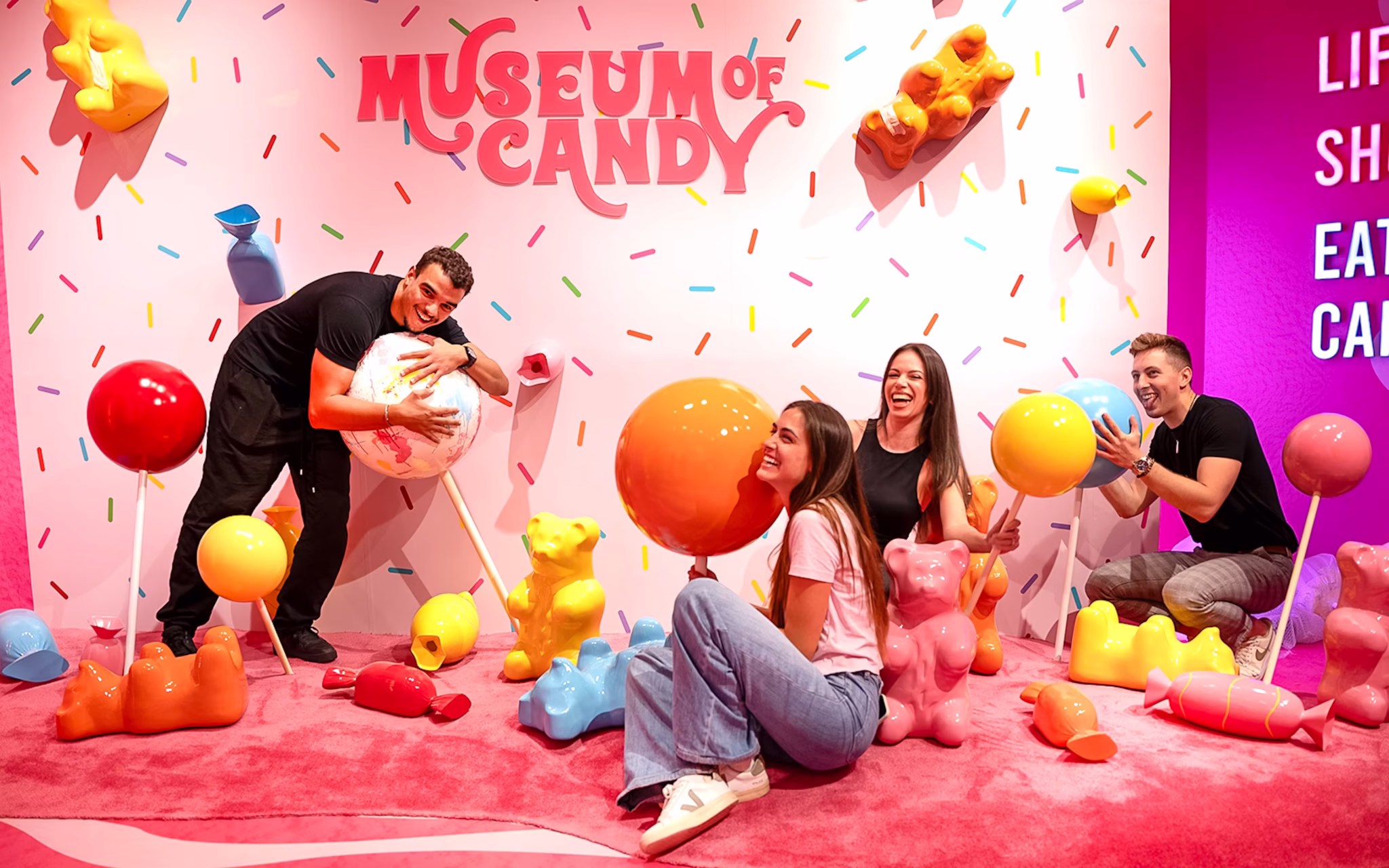 A group of playful people in Candy Museum Dubai
